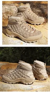 Detail of khaki outdoor tactical boots with diamond stitching and high-grip rubber soles