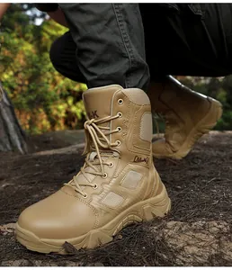 Detail view of khaki tactical combat boots with thick anti-slip rubber soles in outdoor terrain
