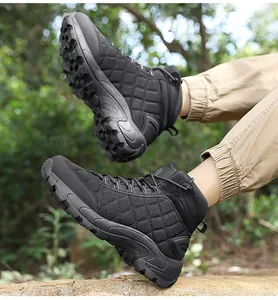 Detail of durable outdoor boots showing anti-slip rubber soles and diamond stitching on fabric