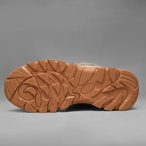 Macro view of non-slip rubber sole with deep tread pattern for outdoor sports shoes