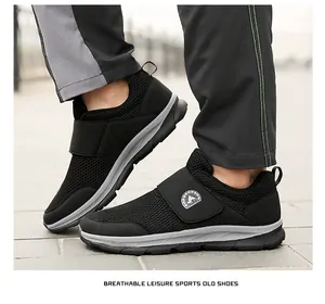 Detail of black breathable mesh walking shoes with adjustable hook and loop closure