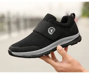 Detail view of black breathable mesh sneaker featuring a convenient Velcro closure system