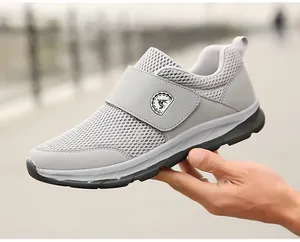 Detail of lightweight grey mesh walking shoe featuring convenient hook and loop fastener
