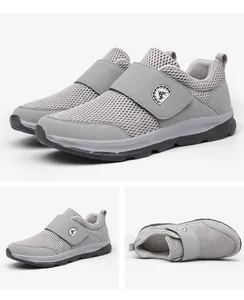 Detail view of grey breathable mesh shoes with adjustable hook and loop strap closure
