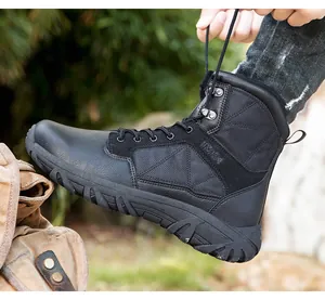 Detail of high-top black tactical boots showing durable leather texture and metal eyelets