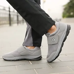Grey breathable mesh walking shoes for elderly men with velcro closure and soft sole