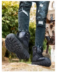 Detailed view of heavy-duty non-slip rubber soles on black tactical outdoor combat boots