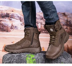 Detail of dark brown outdoor tactical boots with side zipper and rugged anti-slip rubber sole