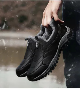 Detail of warm grey faux fur lining and anti-slip rubber sole on men's winter sport boot