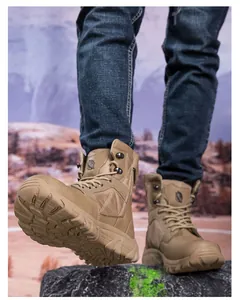Macro detail of khaki outdoor combat boots featuring textured leather and durable rubber soles