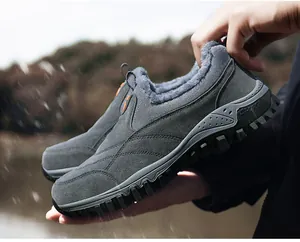 Macro detail of the warm faux fur lining and non-slip rubber sole of men's winter shoes