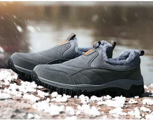 Close-up of non-slip rubber sole and warm grey fur lining on men winter snow boots