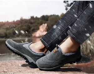 Detail of warm winter snow boots for men featuring faux fur lining and anti-slip rubber sole