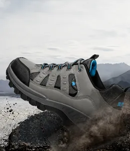 Dynamic action shot of hiking boots kicking up gravel on rugged mountain terrain