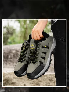 Army green hiking boots with reinforced toe and dual-color laces shown in nature
