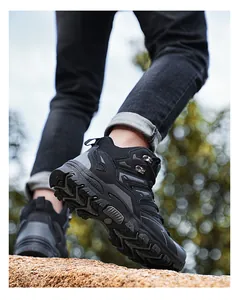 Detailed view of non-slip rubber sole with deep tread on high-top hiking boots