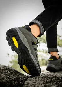 Detail of waterproof nano-leather outdoor hiking boots showing high-grip rubber soles