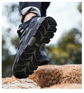 Low angle view of outdoor hiking boots showing heavy-duty anti-slip rubber sole treads