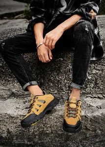 Outdoor detail of ginger and black hiking boots showing rugged anti-slip rubber soles
