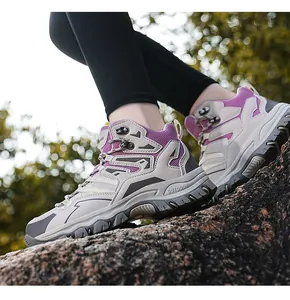 Detailed close-up of purple outdoor hiking shoes with reinforced metal lace eyelets