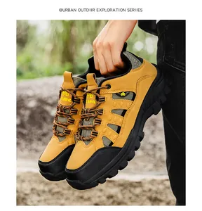 Close-up of yellow high-top hiking boots with anti-slip rubber soles for outdoor use