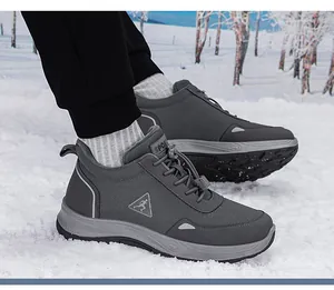 Outdoor snow scene of warm winter walking shoes with elastic drawstring and thick soles