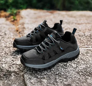 Detail of high-top hiking boots with reinforced toe and anti-slip rubber outsole