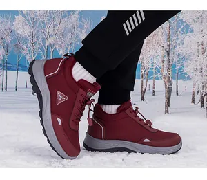Winter thermal high-top sneakers with fleece lining and non-slip sole shown on snow