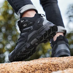 Rugged high-top hiking boots for men and women featuring anti-slip rubber soles for outdoors