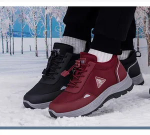 Detail showing red and black thermal hiking boots with warm fur lining in snow