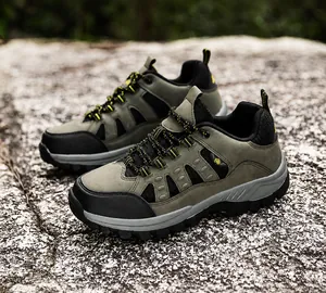 Detail of high-top hiking boots with reinforced toe cap and anti-slip deep-tread sole