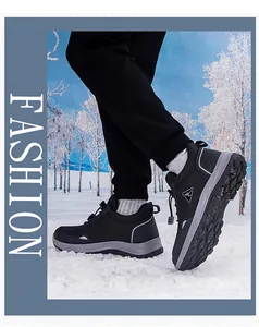 Detail of waterproof outdoor hiking shoes with drawstring laces on snowy terrain