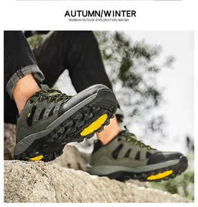 Detail showing high-grip anti-slip rubber outsole of army green hiking boots on rocky terrain