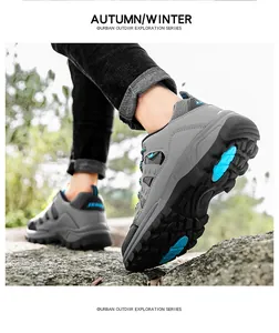 Close-up of hiking shoes with non-slip rubber soles and blue grip pads on rocky terrain