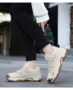 Detailed side view of beige retro sneakers featuring mesh fabric and durable gum sole