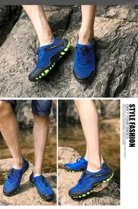 Detail of blue breathable mesh upper and green non-slip rubber sole for trekking shoes