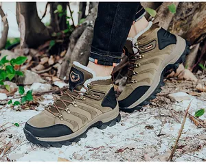 Outdoor shot of men's thermal snow boots featuring thick fleece lining and durable rubber soles