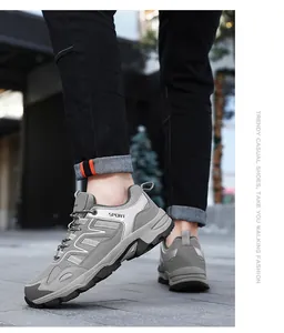 Detail showing the side of grey fashion sport sneakers with mesh fabric and Sport text