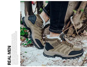 Outdoor shot of men's khaki winter hiking boots featuring warm faux fur lining and rugged soles