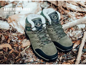 Detail of army green winter hiking boots with warm faux fur lining and metal eyelets