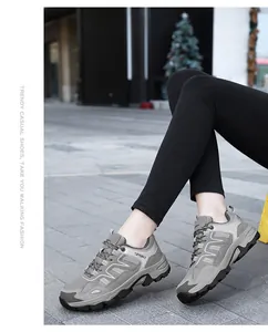 Close-up of grey casual sneakers with breathable mesh panels and thick rubber soles