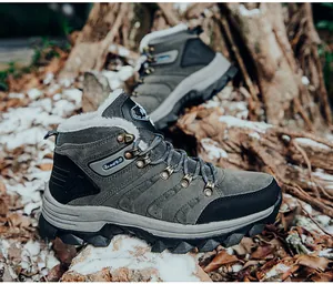 Detail of warm faux fur lining and durable rubber sole on grey outdoor hiking snow boots