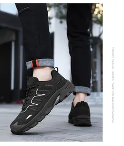 Close-up of black mesh hiking shoes with cushioned soles and white side waves detail