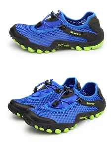 Detail of blue breathable mesh outdoor wading shoe with vibrant green lugged rubber sole