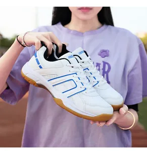 Detail of professional sports shoes with non-slip gum rubber sole and white mesh upper