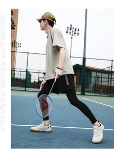 Outdoor volleyball court scene featuring a complete professional sports outfit and racket