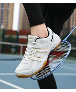 Close-up of white court sports shoes with breathable mesh and gum rubber soles
