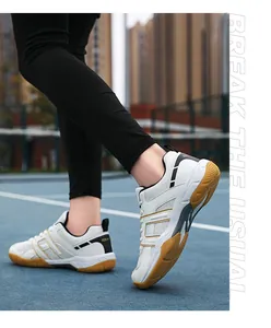 Outdoor action shot of non-slip indoor sports shoes with gum soles on a blue track