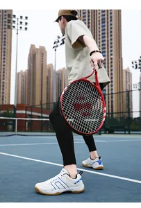 Dynamic view of breathable white volleyball shoes with blue stripes on a professional court