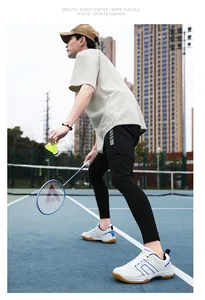 Action shot of professional white and blue indoor sports shoes on a badminton court